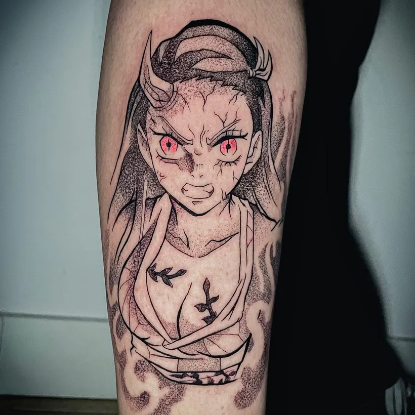 Tatuaje anime de Nezuko en línea fina y puntillismo en la pierna, hecho en ESAP Madrid Tatuaje anime de Nezuko en línea fina y puntillismo en la pierna, hecho en ESAP Madrid
